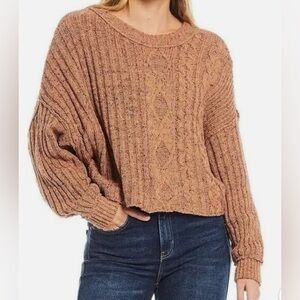 Free People Cutting Edge" cable-knit sweater.